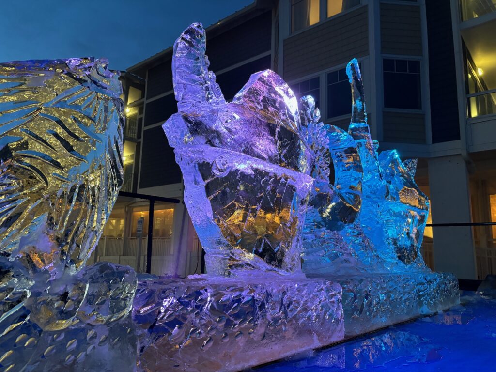 ice sculptures in front of a building at night