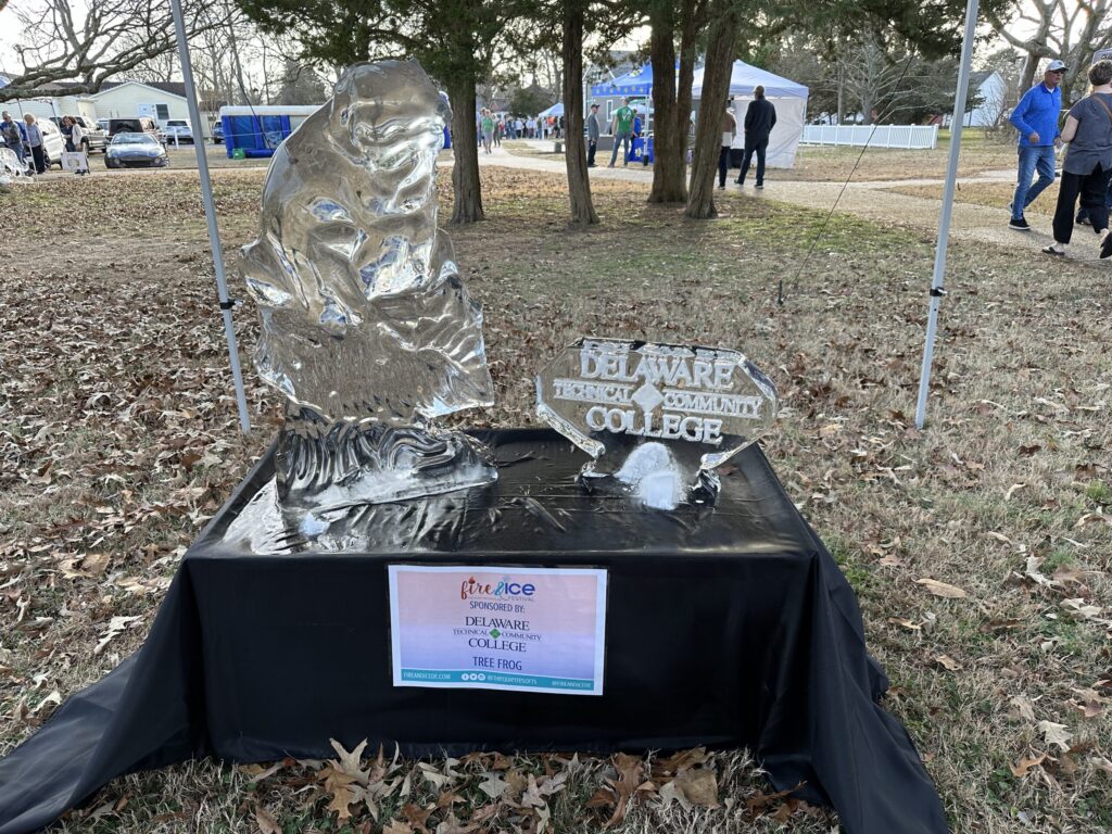 a statue of a person sitting on top of a table