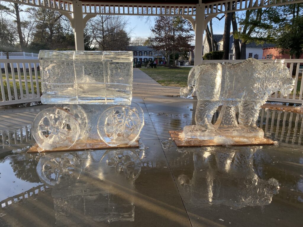 a couple of ice sculptures sitting on top of a table