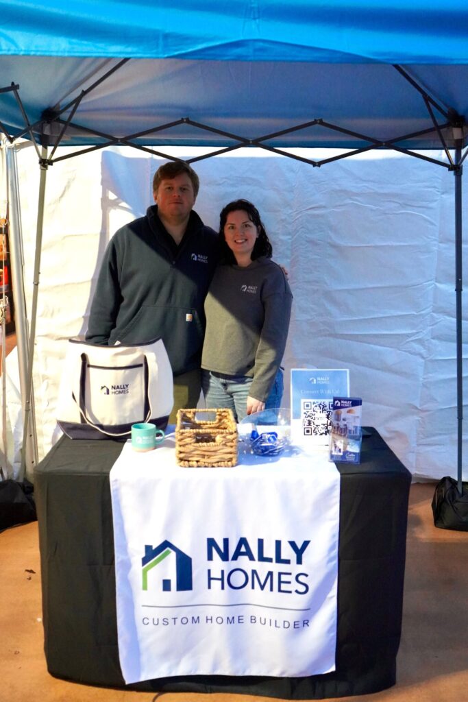 a man and a woman standing under a tent
