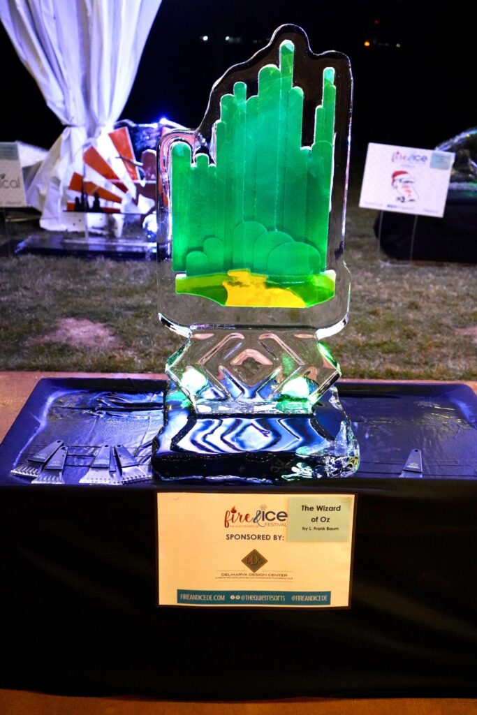 a glass award sitting on top of a table
