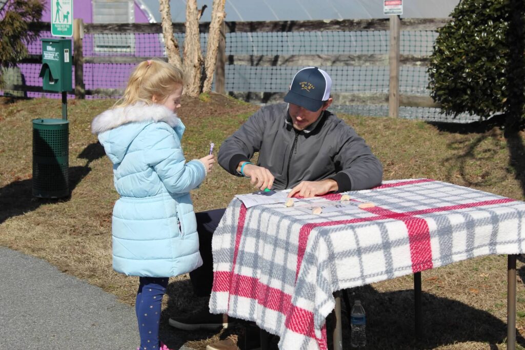 a man and a little girl sitting at a table