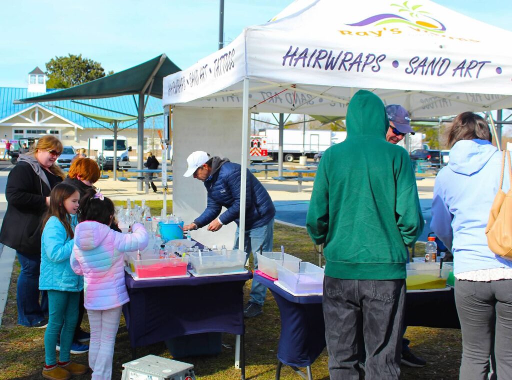 a group of people standing around a table