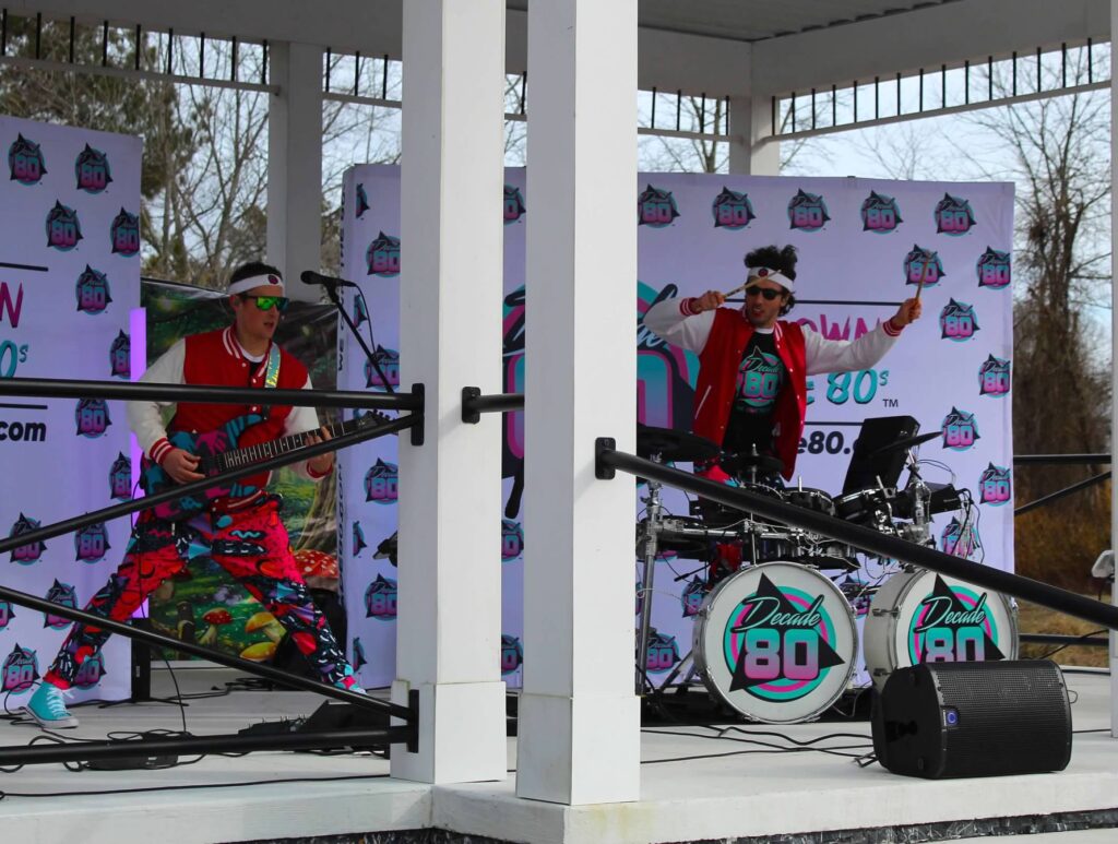 a group of people standing on top of a stage