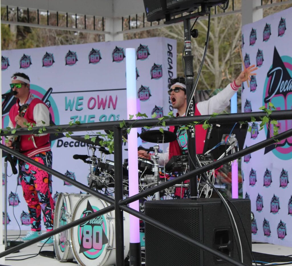 a band performing on stage at a festival