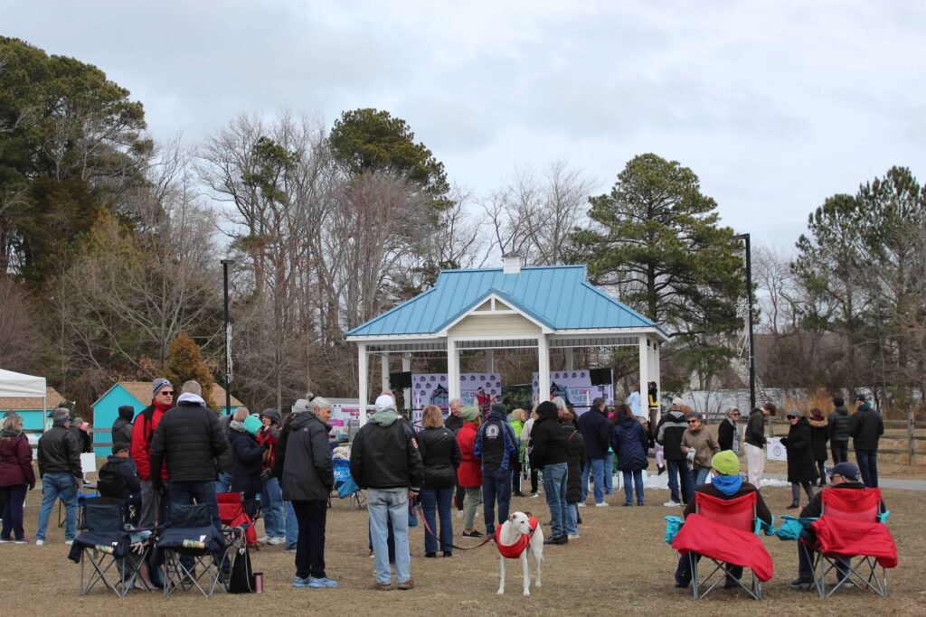 a group of people standing in a field