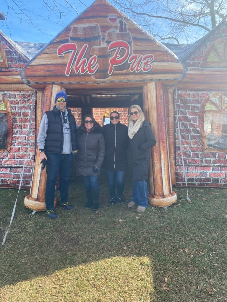a group of people standing in front of a building
