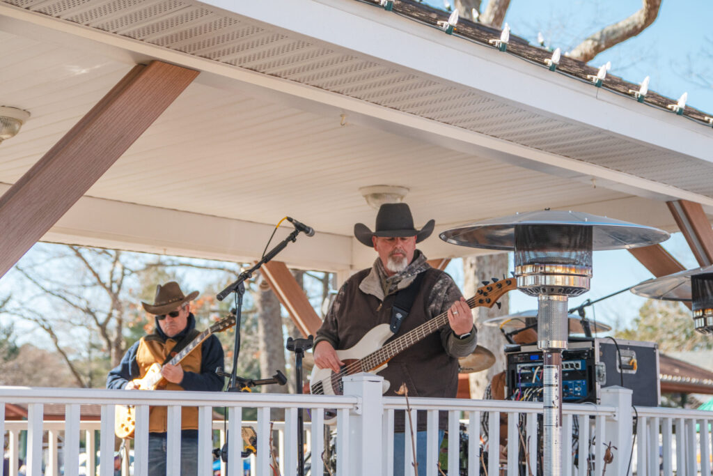 a group of people playing music on a porch