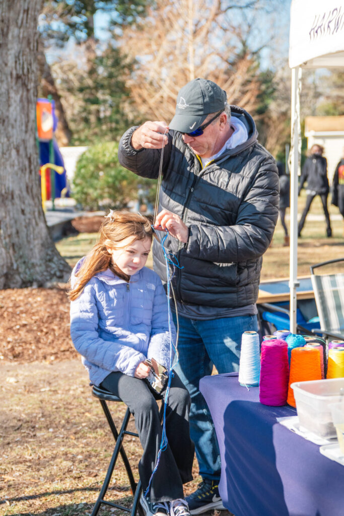a man and a little girl sitting at a table