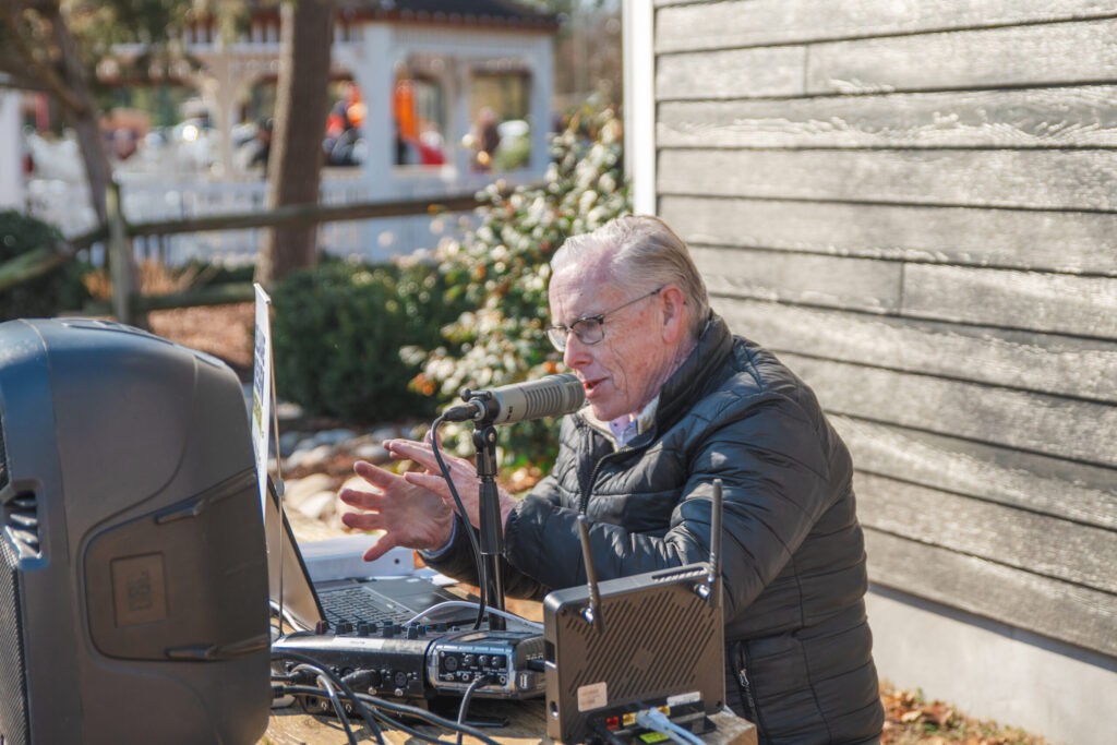 a man sitting in front of a laptop computer