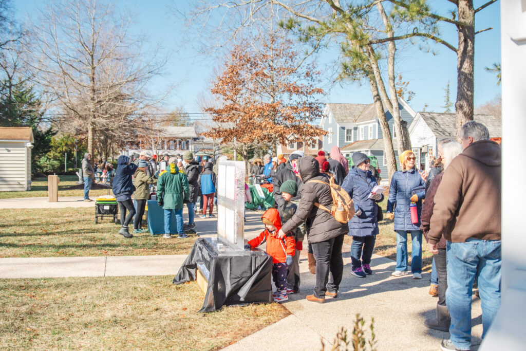 a group of people standing around a cemetery