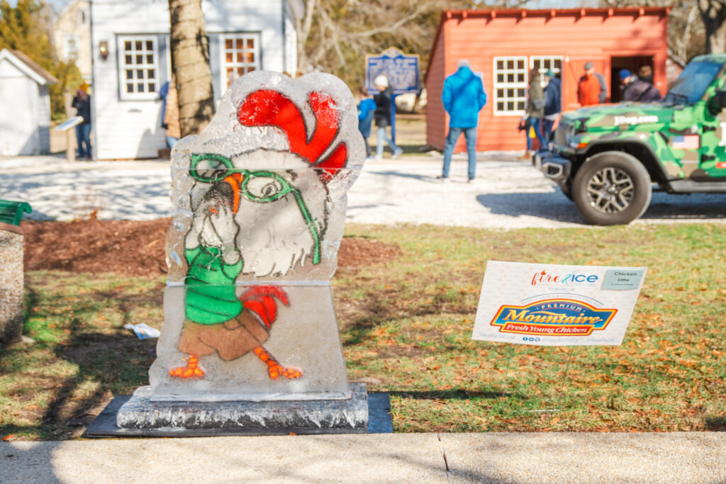 a statue of a rooster is on display
