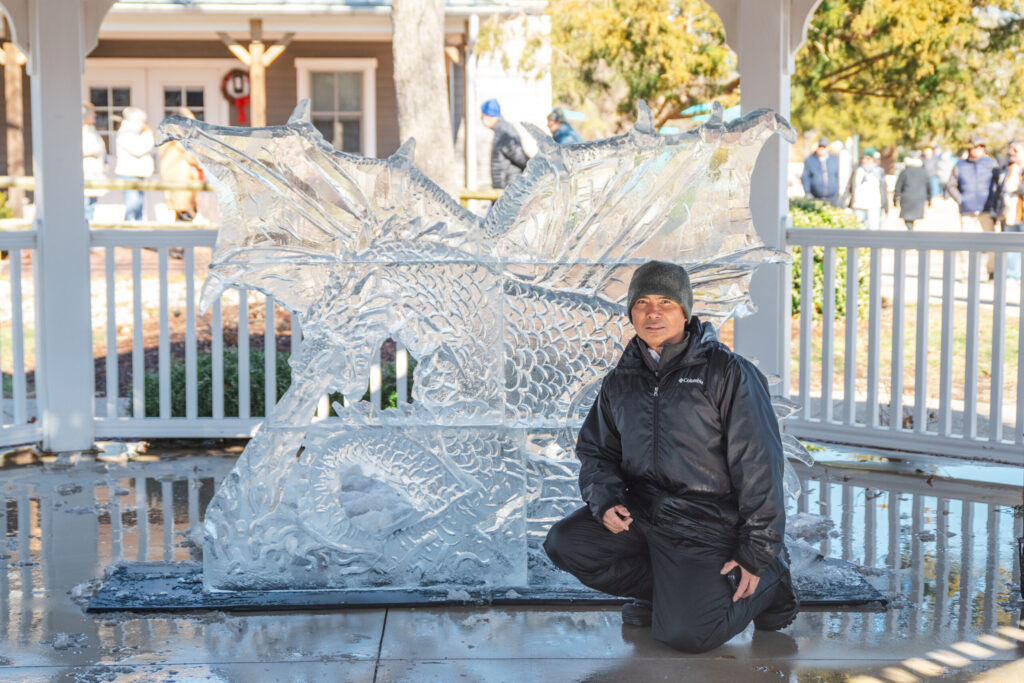 a man sitting on a bench in front of a building