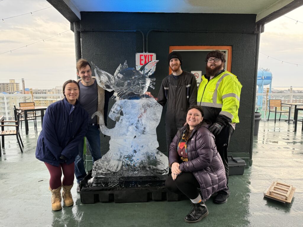 a group of people standing in front of a statue