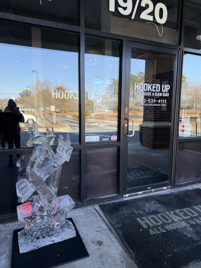 a broken glass window in front of a building