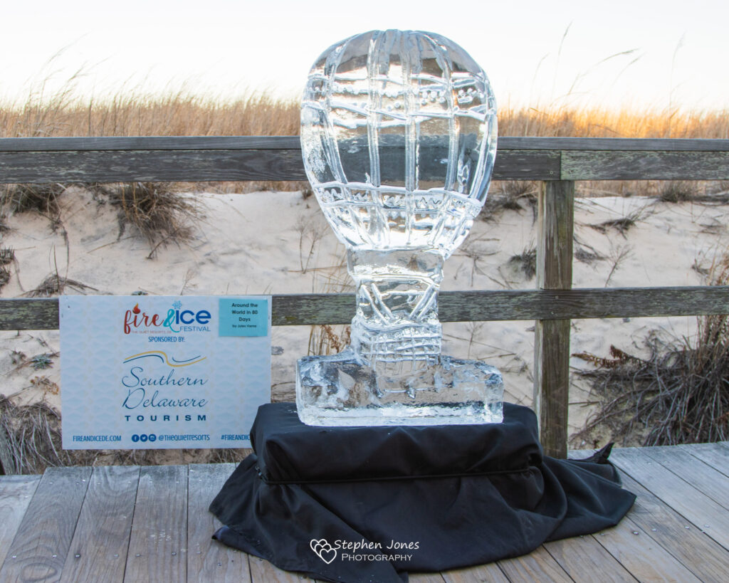a glass trophy sitting on top of a wooden table
