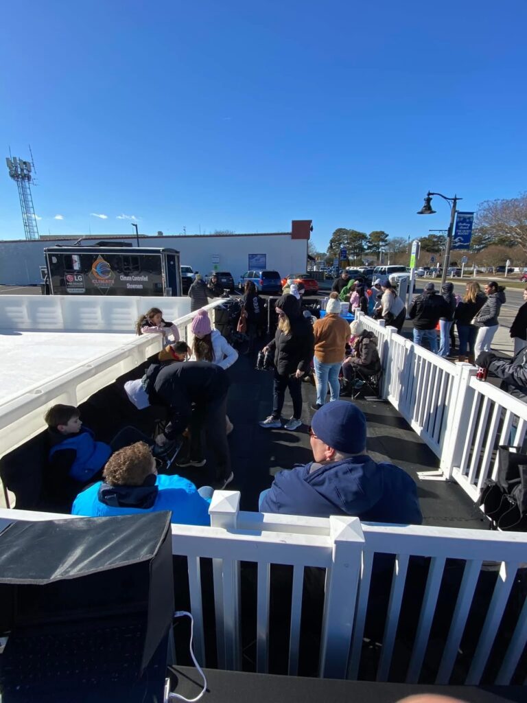 a group of people standing on top of a snow covered slope