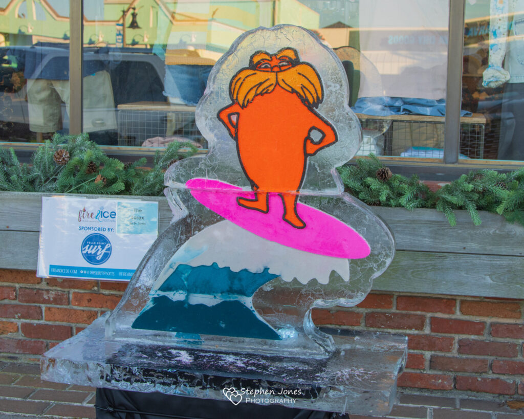 a glass sculpture of a person on a surfboard