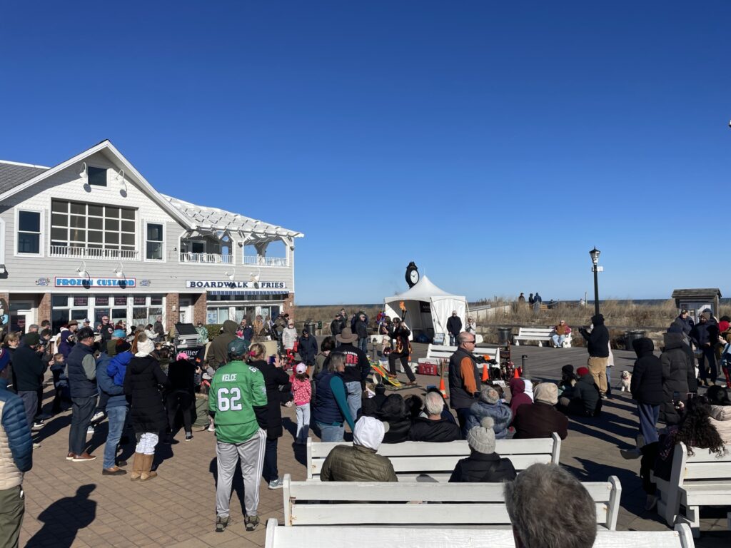 a crowd of people standing around a building