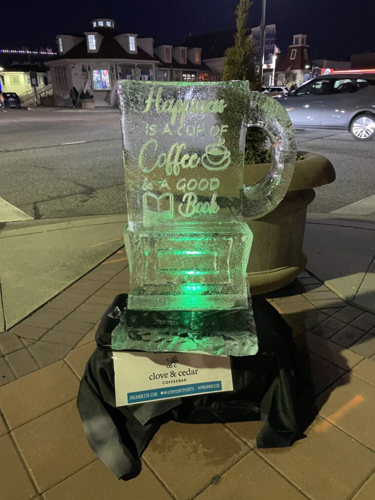 a large ice sculpture sitting on top of a sidewalk