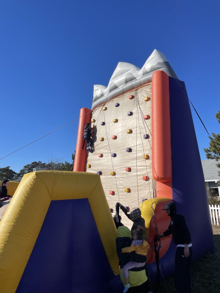 a group of people climbing up the side of a building