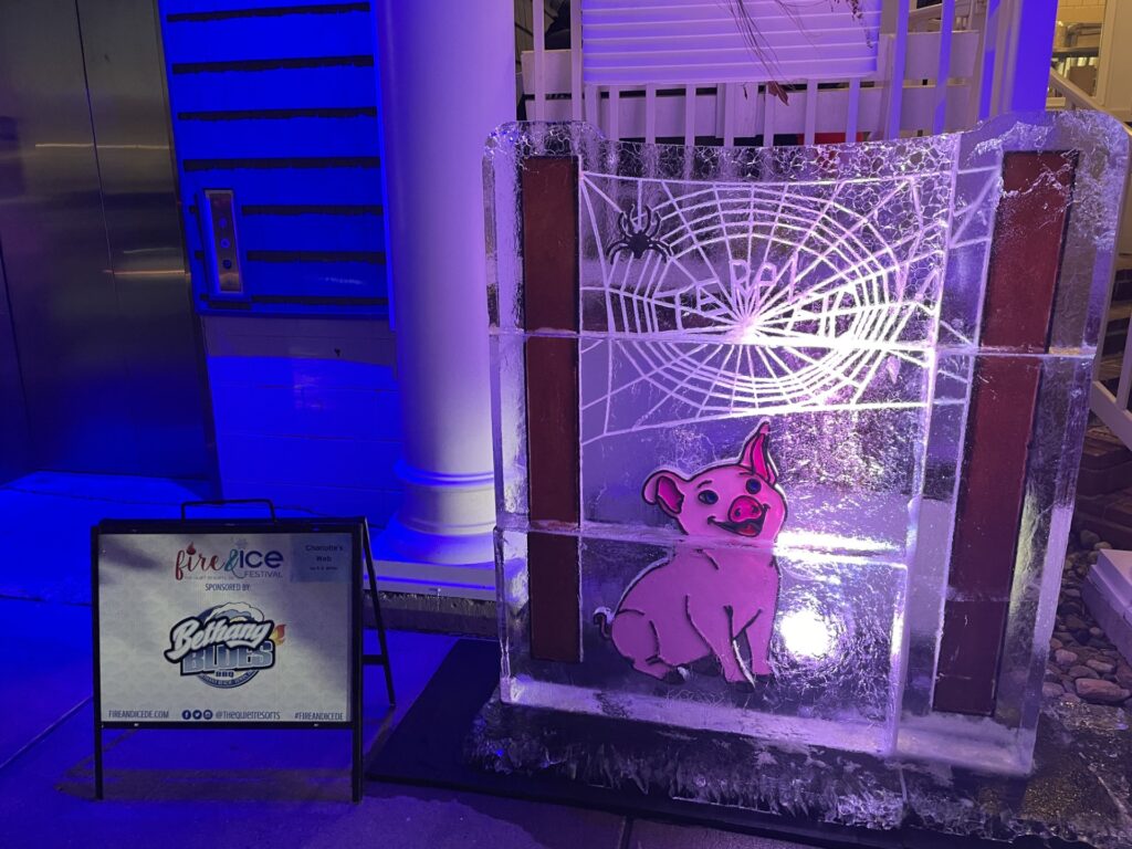 an ice sculpture of a dog in front of a building