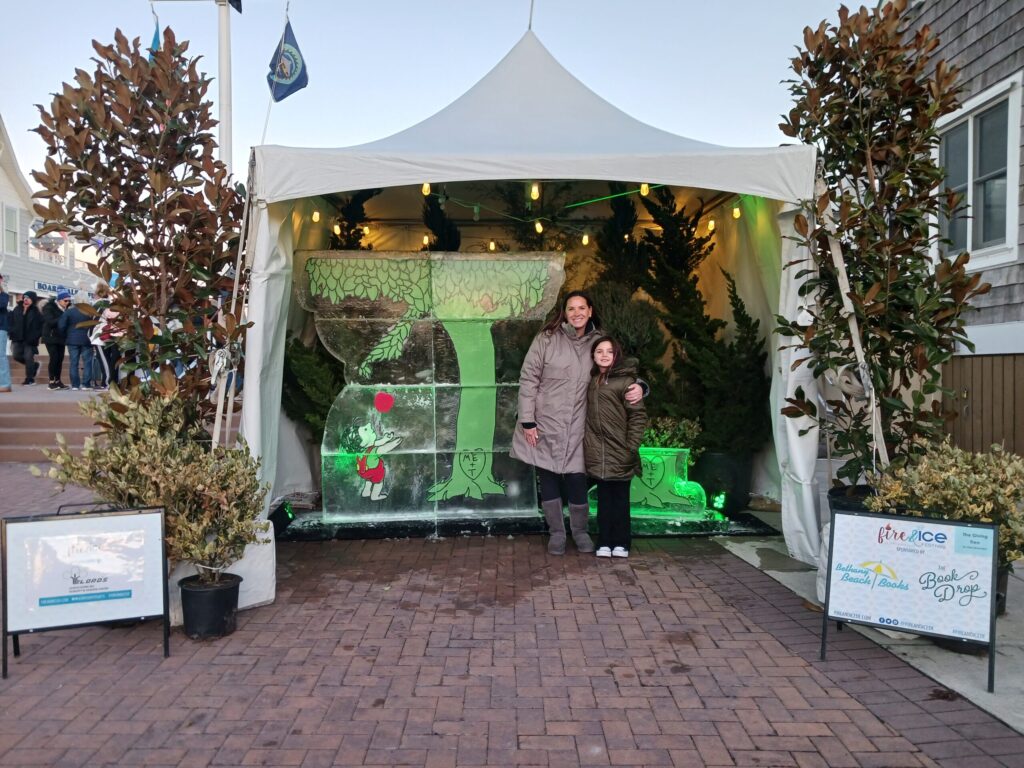 a couple of people standing in front of a tent