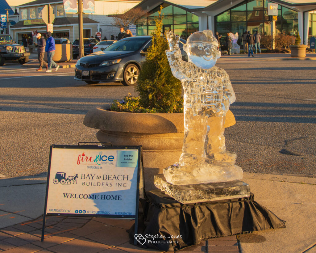 a statue of a man is in front of a building