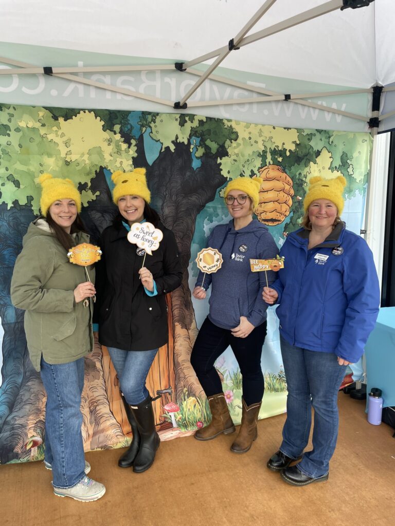 a group of people standing under a tent