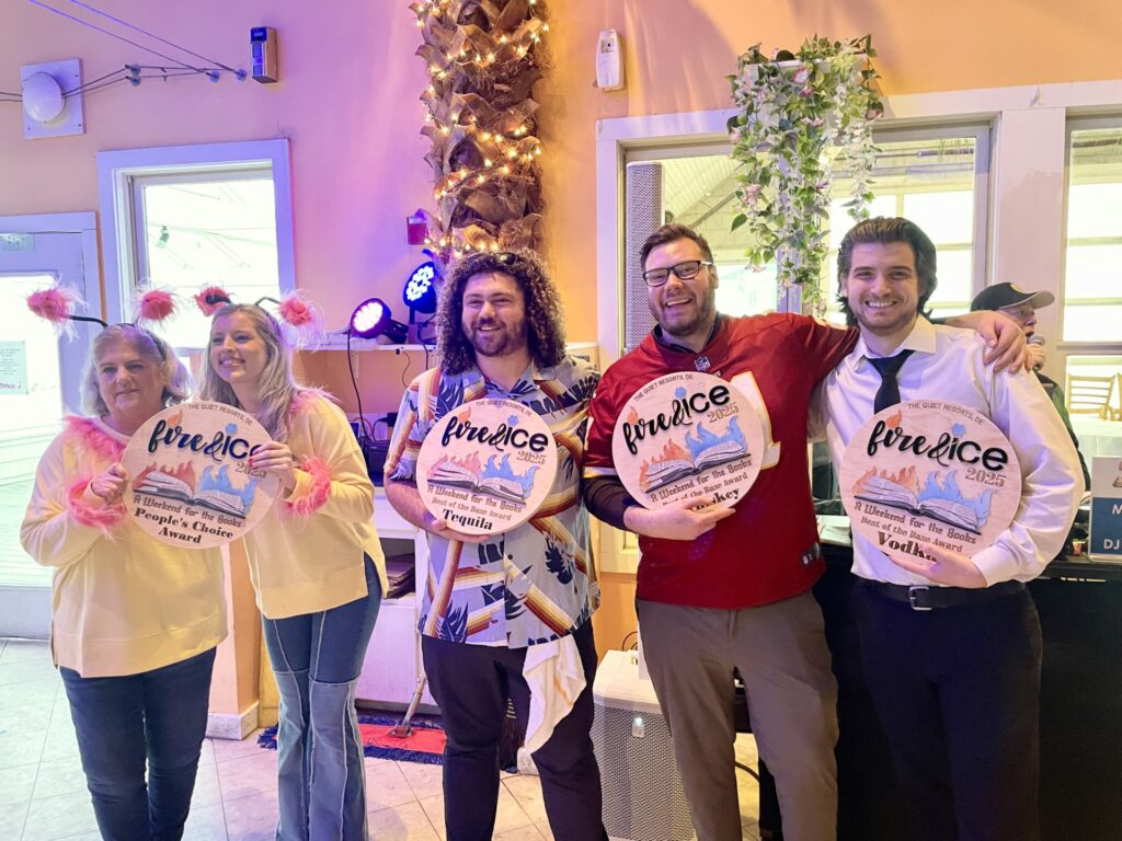 a group of people holding up signs in a room