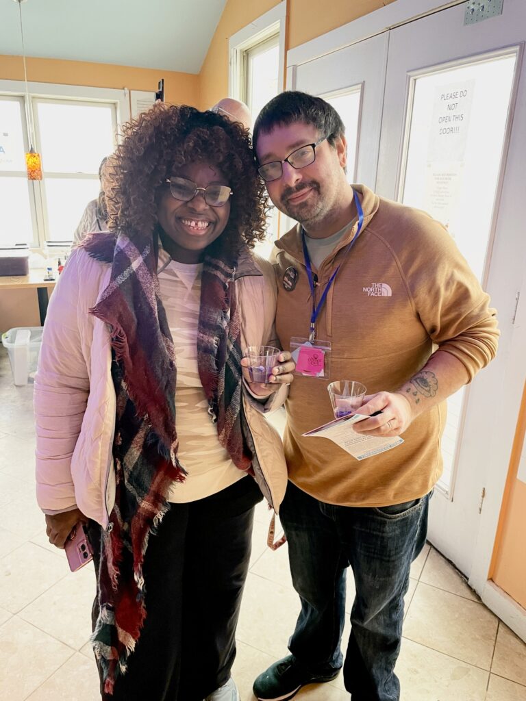 a couple of people standing next to each other