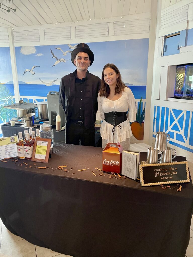 a man and a woman standing behind a table