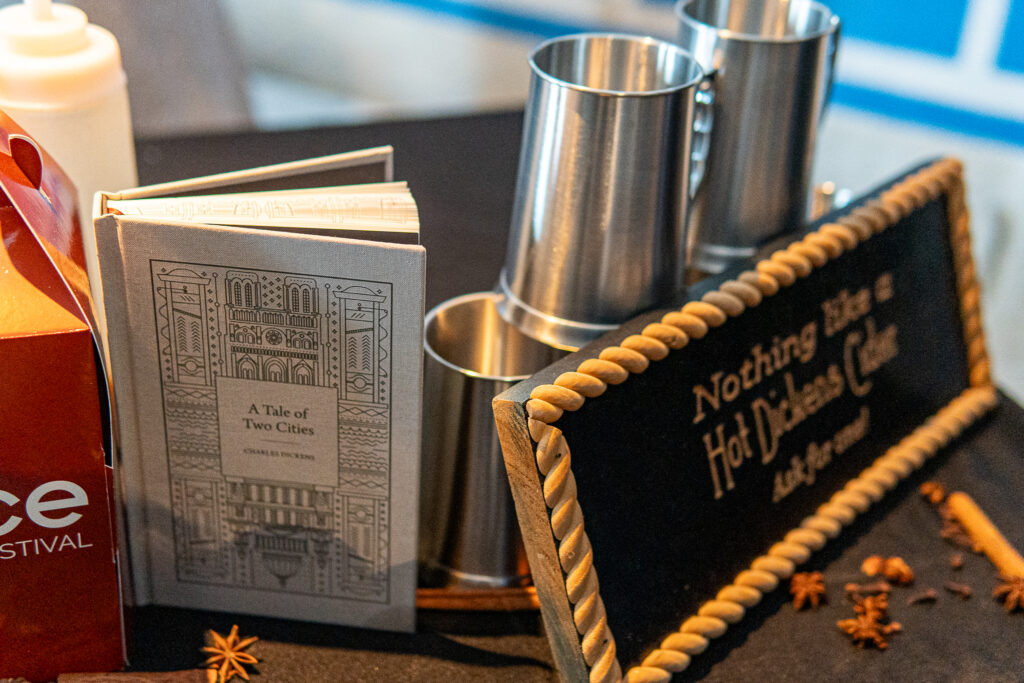 a table topped with books and a bottle of juice