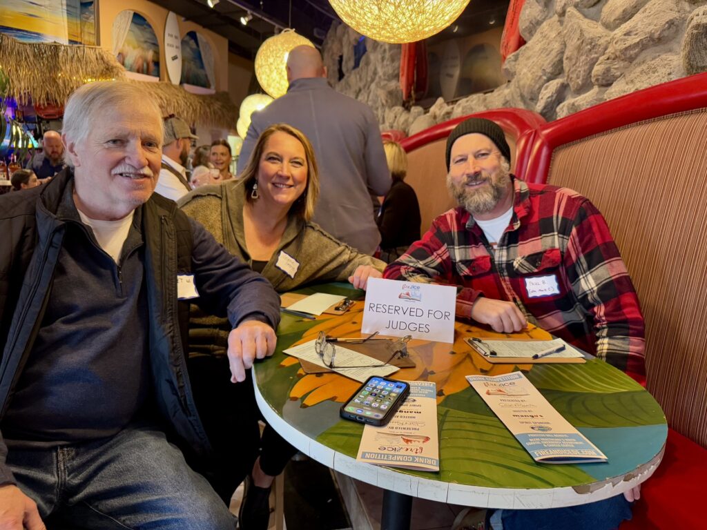 a group of people sitting at a table in a restaurant