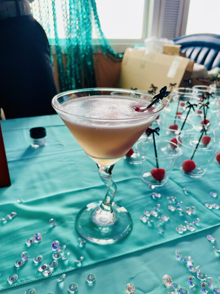 a martini sitting on top of a blue table