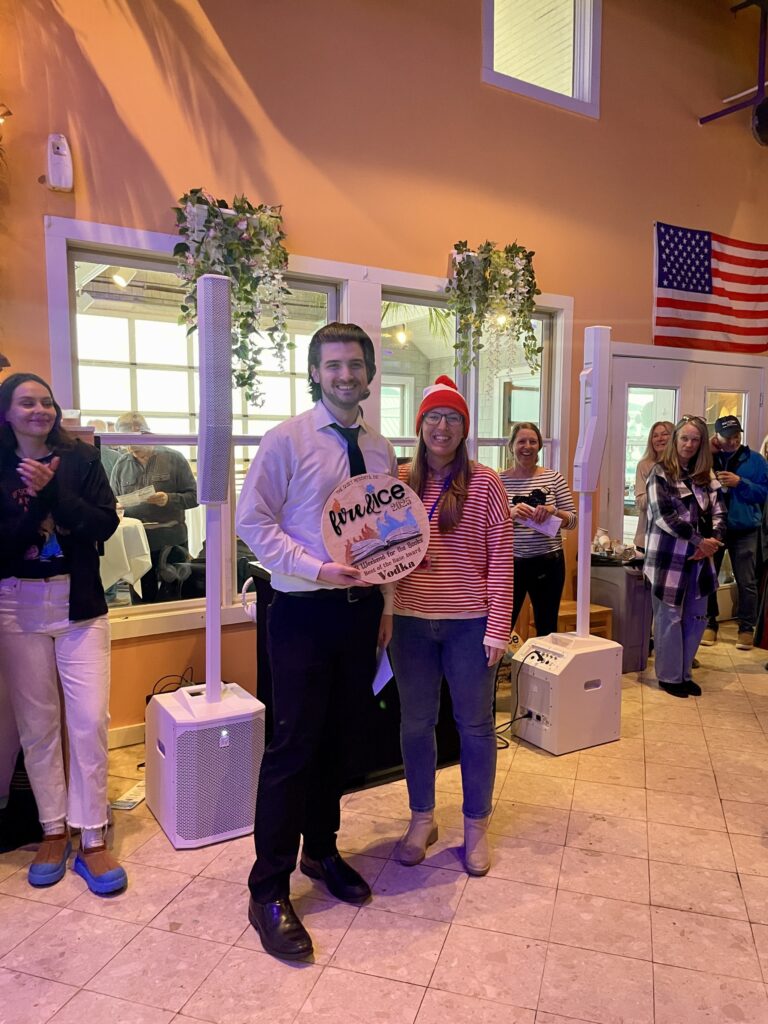 a man standing in front of a crowd of people