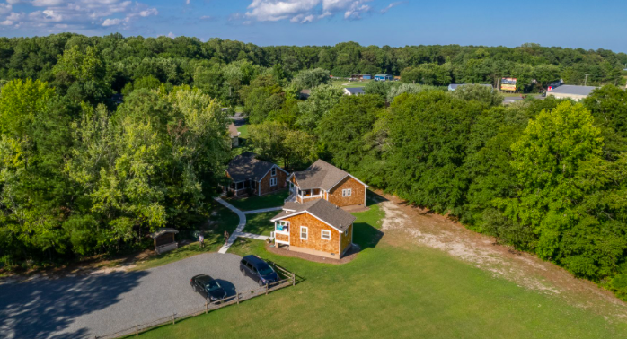 an aerial view of a home surrounded by trees