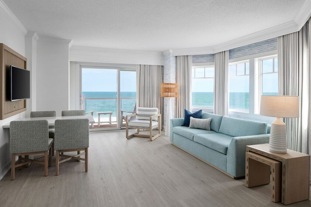 a living room filled with furniture and a flat screen tv