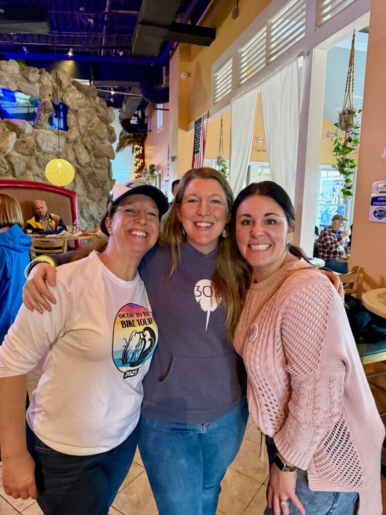 a group of women standing next to each other