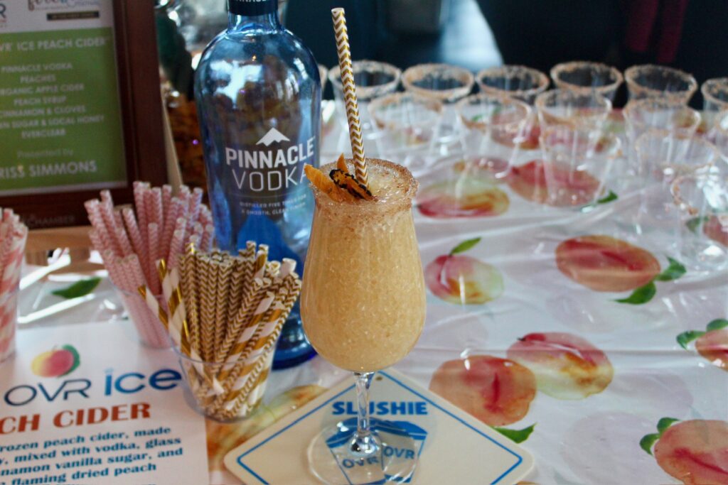 a table topped with lots of glasses filled with drinks