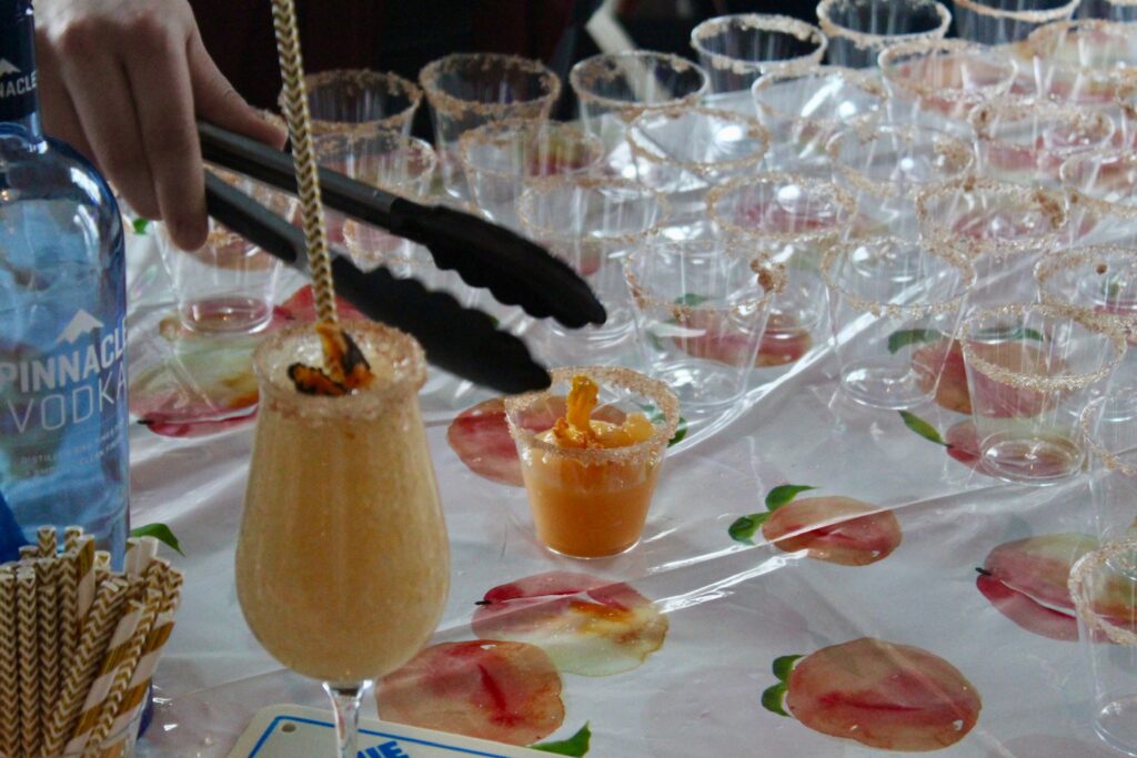 a table topped with lots of glasses filled with drinks