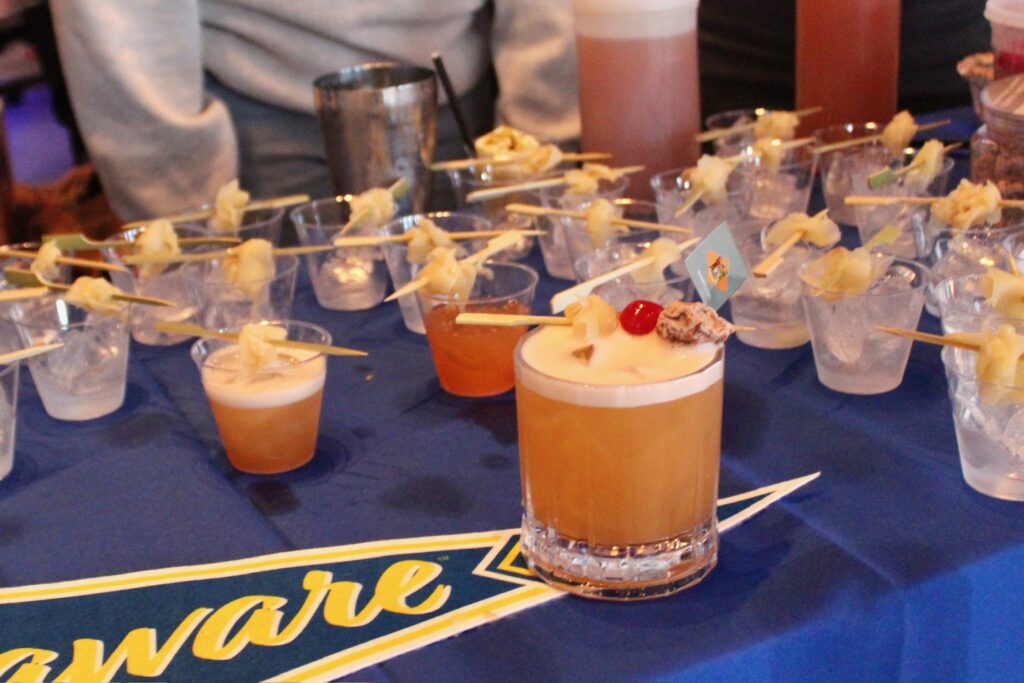 a table topped with cups filled with drinks