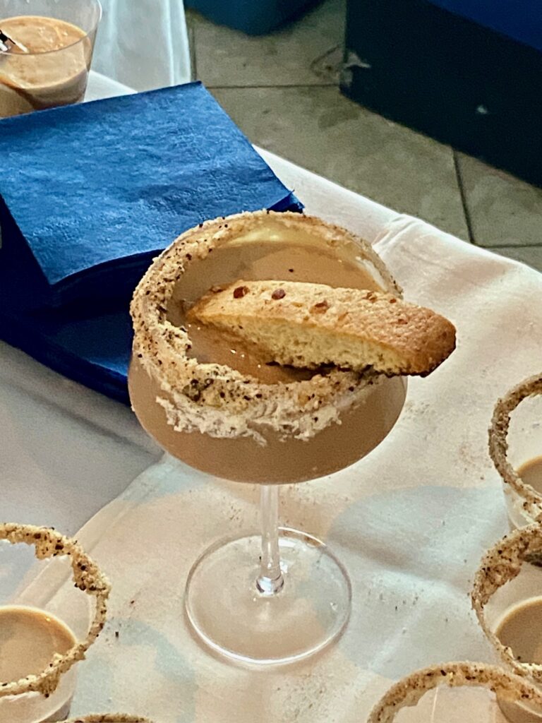 a table topped with glasses filled with desserts