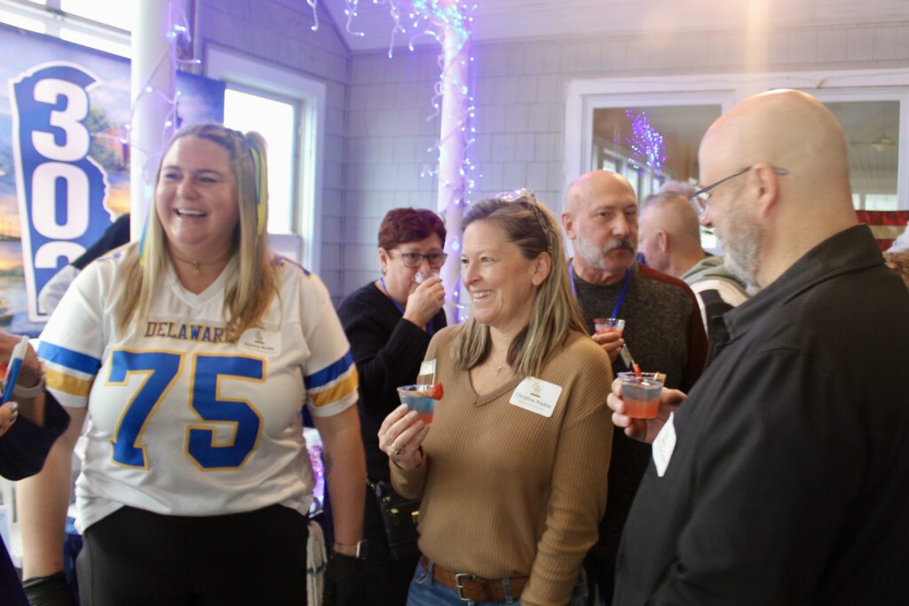 a group of people standing around each other