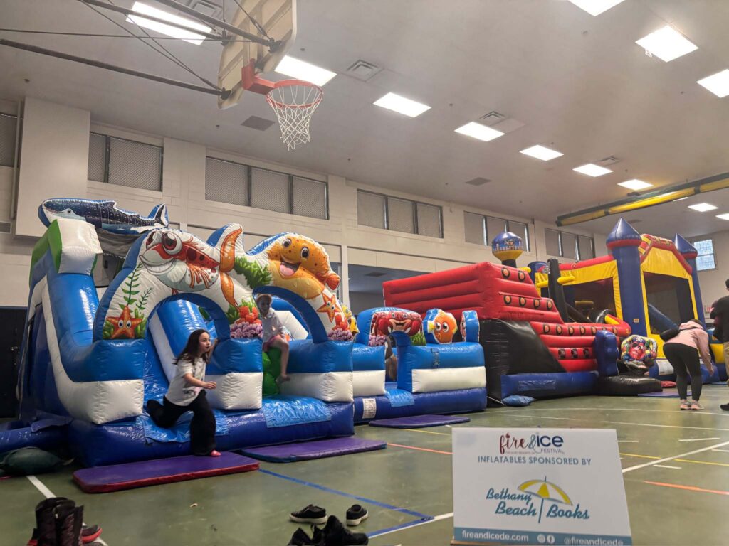 a large inflatable bounce house with a basketball hoop