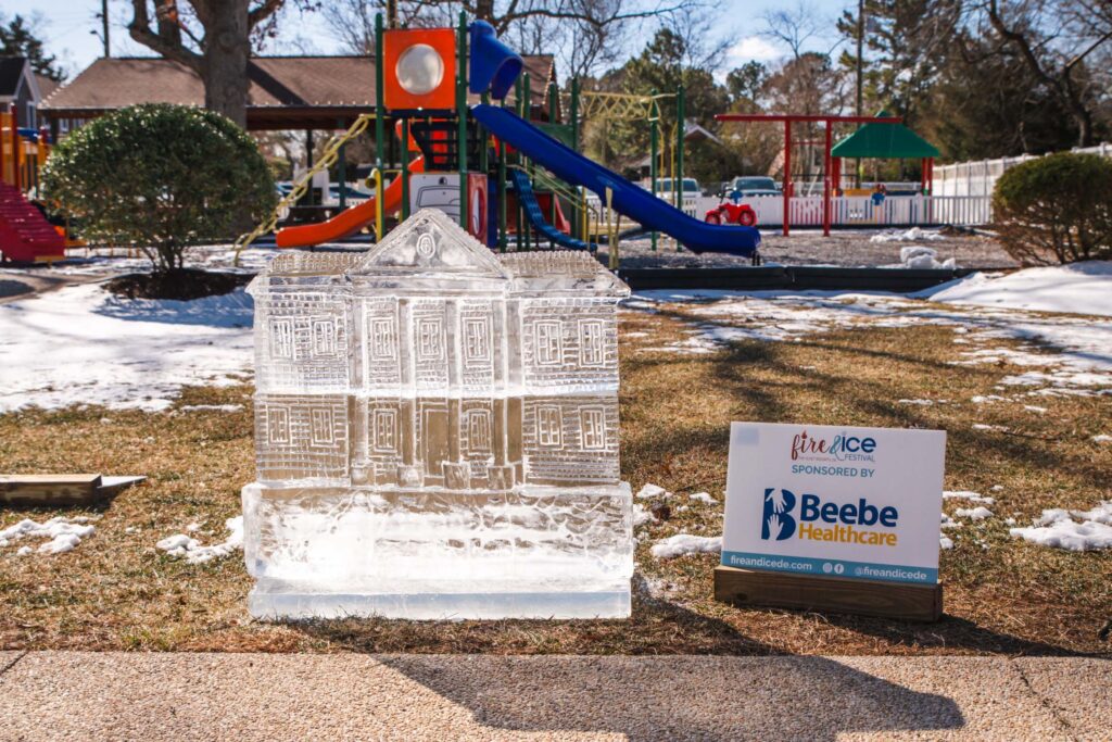 an ice sculpture of a house in a park