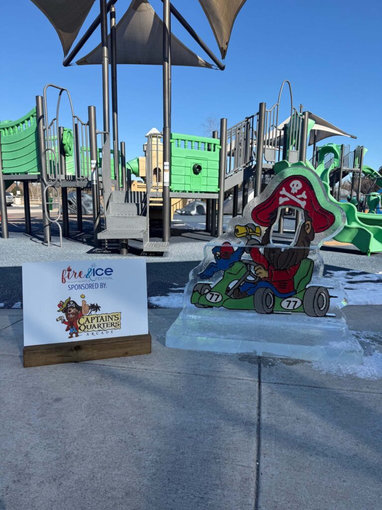 a playground with a sign and some slides