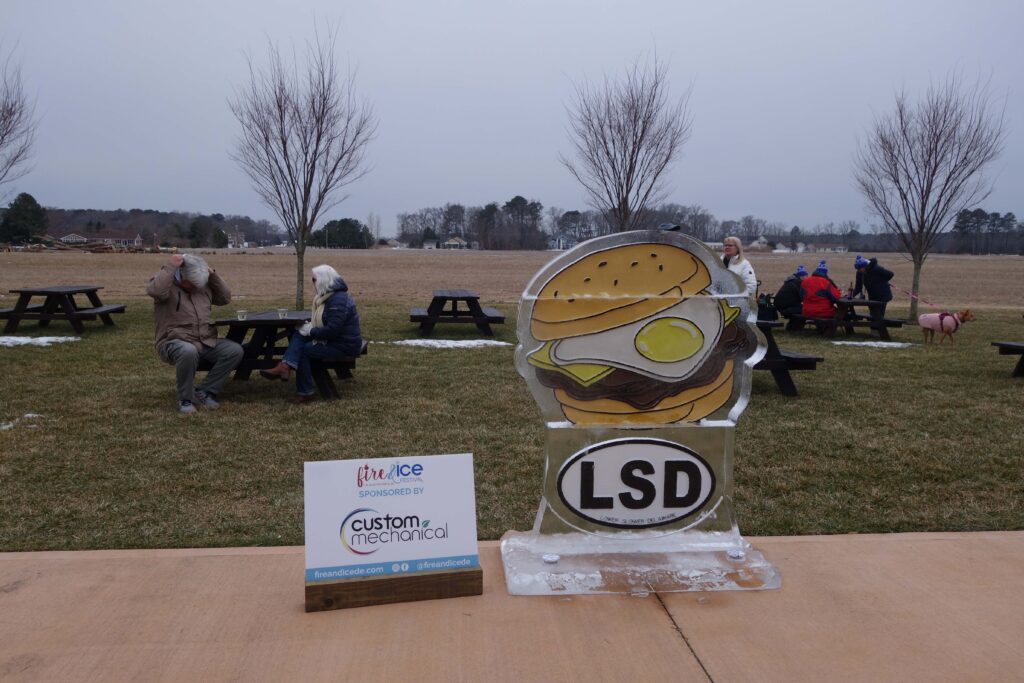 a glass trophy sitting on top of a wooden table