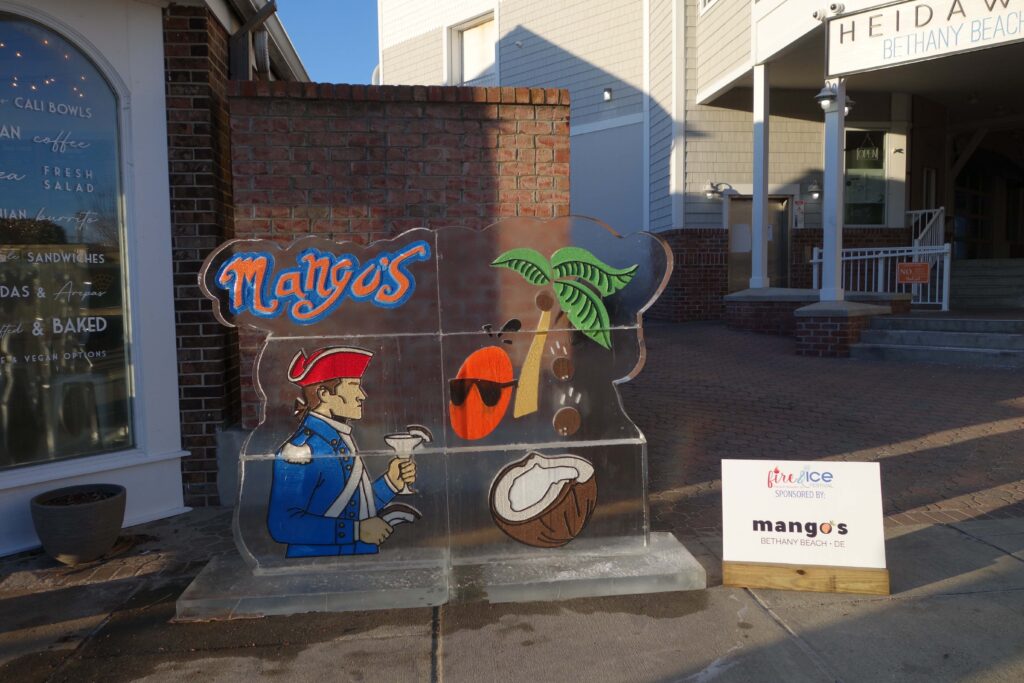 a street corner with a sign and a building