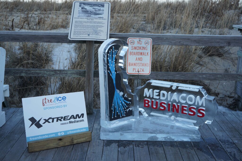 a wooden deck with signs and a sign on it